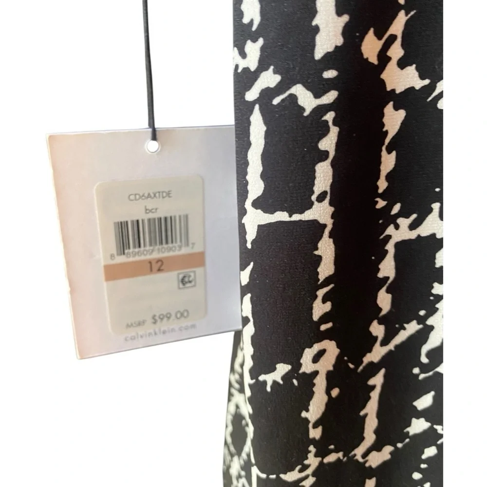 Calvin Klein Black and White Long Sleeve Faux Wrap Dress.  Size 12